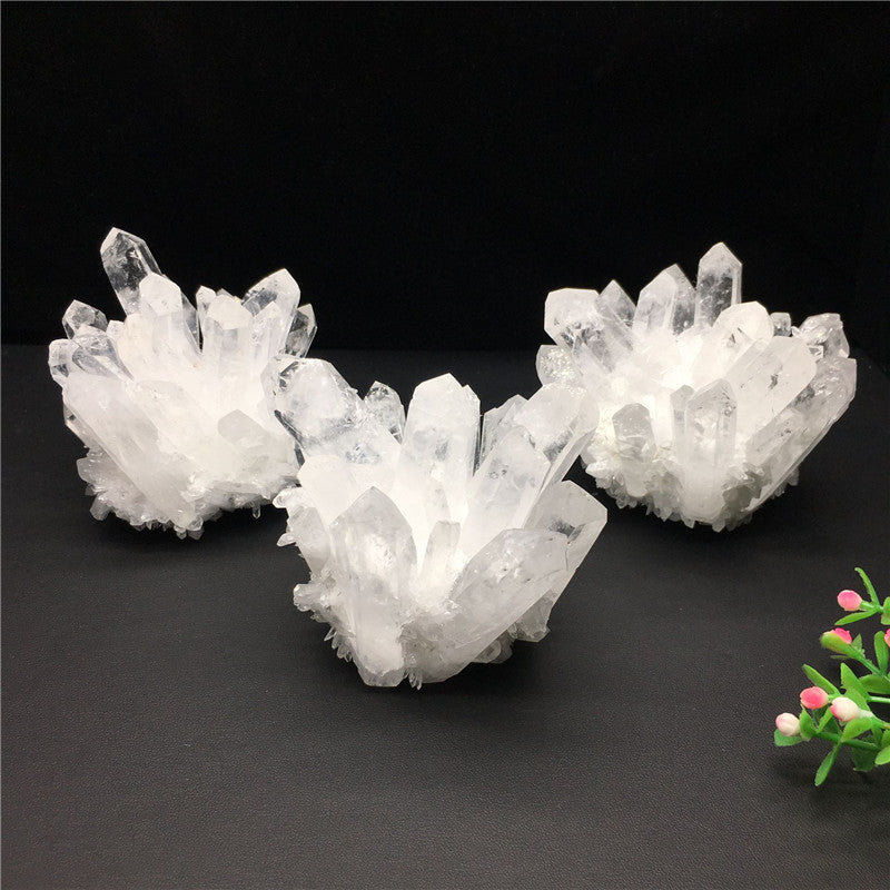 3 clear quartz clusters on display 